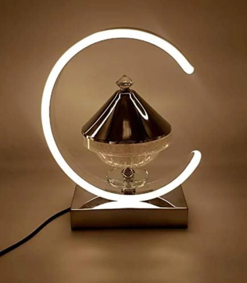 Decorative lamp with a crescent moon design on a brown background